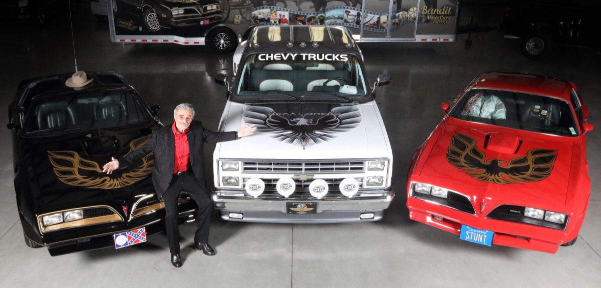 Burt Reynolds with a trio of his personal cars. (Barrett Jackson)