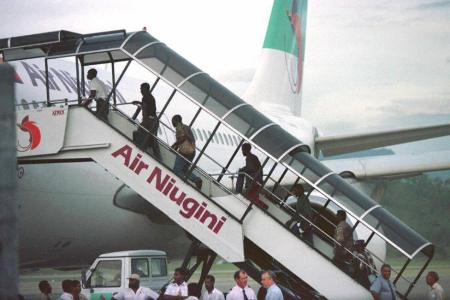 An Air Niugini flight in Port Moresby, Papua New Guinea, (PNG) 21 March. An Air Niugini Flight Crash Landed onto the waters of Micronesia September 28, and all onboard survived.  (Photo by STR/AFP/Getty Images)