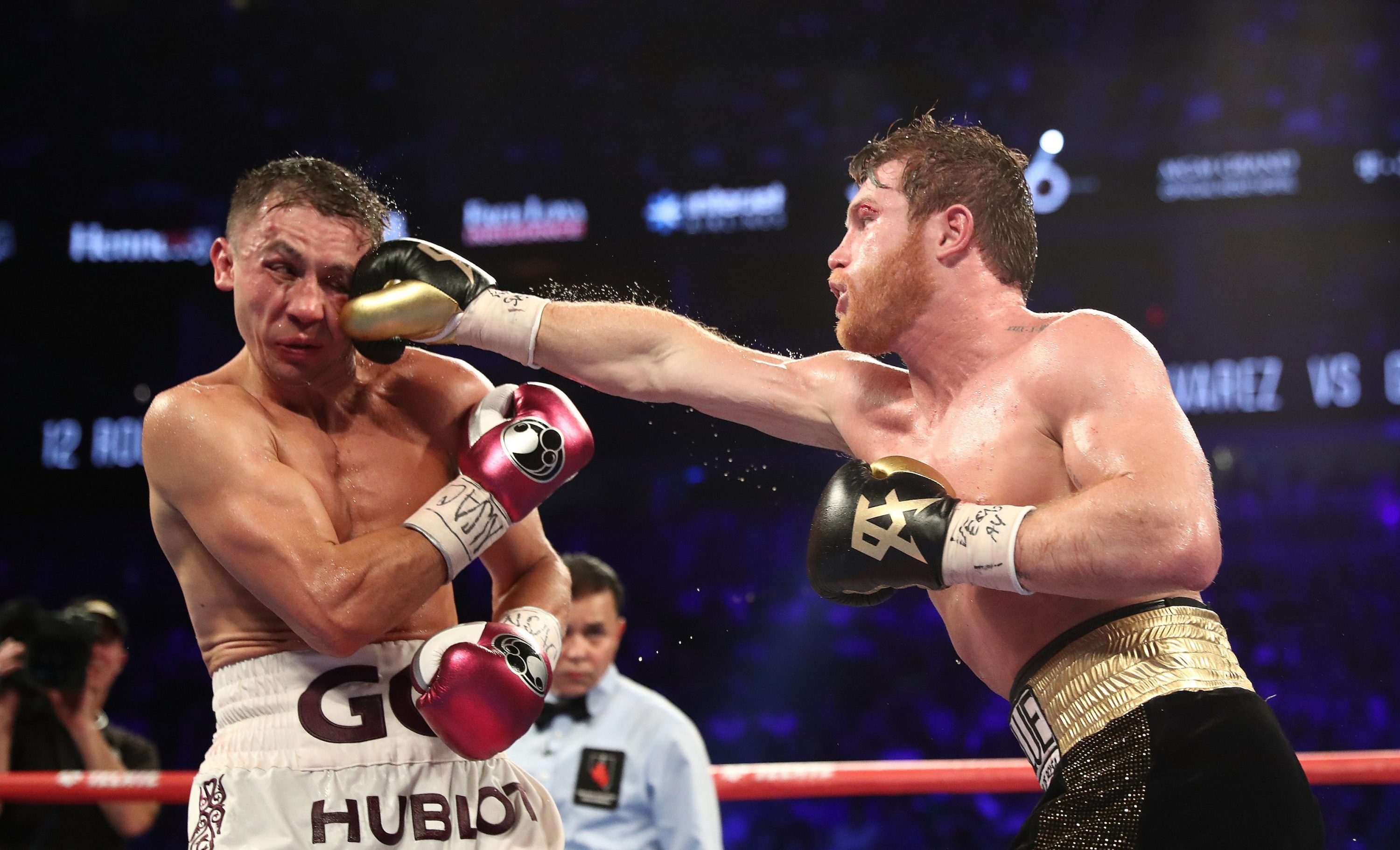 During arguably boxing's biggest fight of 2018, Canelo Alvarez punches Gennady "GGG" Golovkin during their
WBC/WBA middleweight title fight at T-Mobile Arena on September 15, 2018 in Las Vegas, Nevada. (Al Bello/Getty Images)
