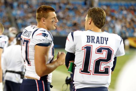 CHARLOTTE, NC - AUGUST 24: New England Patriots tight end Rob Gronkowski (87) and New England Patriots quarterback Tom Brady (12) talk on the sideline during a preseason game between the New England Patriots and the Carolina Panthers on August 24, 2018 at Bank of America Stadium in Charlotte,NC. (Photo by Dannie Walls/Icon Sportswire via Getty Images)
