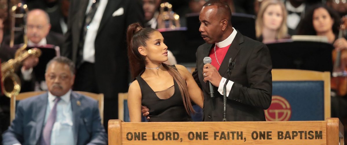 Singer Ariana Grande speaks with Bishop Charles Ellis III after performing at the funeral for Aretha Franklin at the Greater Grace Temple on August 31, 2018 in Detroit.  (Photo by Scott Olson/Getty Images)