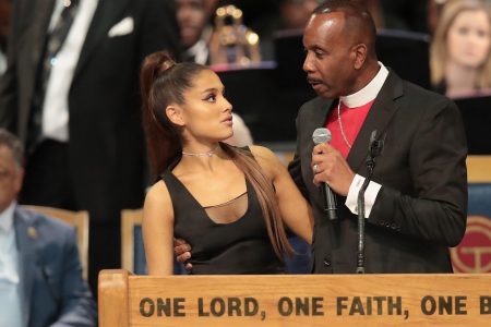 Singer Ariana Grande speaks with Bishop Charles Ellis III after performing at the funeral for Aretha Franklin at the Greater Grace Temple on August 31, 2018 in Detroit.  (Photo by Scott Olson/Getty Images)