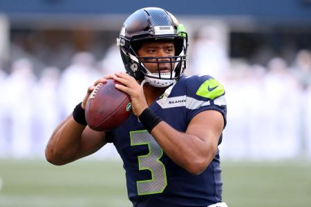 Russell Wilson #3 of the Seattle Seahawks warms up prior to taking on the Oakland Raiders during their preseason game at CenturyLink Field on August 30, 2018 in Seattle, Washington.  (Photo by Abbie Parr/Getty Images)