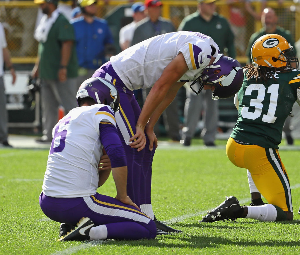 GREEN BAY, WI - SEPTEMBER 16: Daniel Carlson #7 of the Minnesota Vikings (R) reacts after missing a potential game-winning field goal in overtime against the Green Bay Packers at Lambeau Field on September 16, 2018 in Green Bay, Wisconsin. The Vikings and the Packers tied 29-29 after overtime. (Photo by Jonathan Daniel/Getty Images)