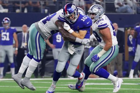 ARLINGTON, TX - SEPTEMBER 16:  Jaylon Smith #54 of the Dallas Cowboys hits Eli Manning #10 of the New York Giants in the third quarter at AT&T Stadium on September 16, 2018 in Arlington, Texas.  (Photo by Tom Pennington/Getty Images)