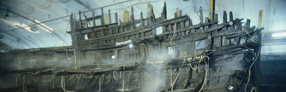 The wooden wreck of the Mary Rose warship is kept wet whilst undergoing conservation in the ship hall, Portsmouth July 1987. The Mary Rose was salvaged from the sea bed in 1982. (Photo by RDImages/Epics/Getty Images)