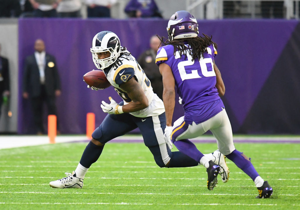 MINNEAPOLIS, MN - NOVEMBER 19: Los Angeles Rams Running Back Todd Gurley II (30) runs with the ball as Minnesota Vikings cornerback Trae Waynes (26) gives chase during a NFL game between the Minnesota Vikings and Los Angeles Rams on November 19, 2017 at U.S. Bank Stadium in Minneapolis, MN. (Photo by Nick Wosika/Icon Sportswire via Getty Images)