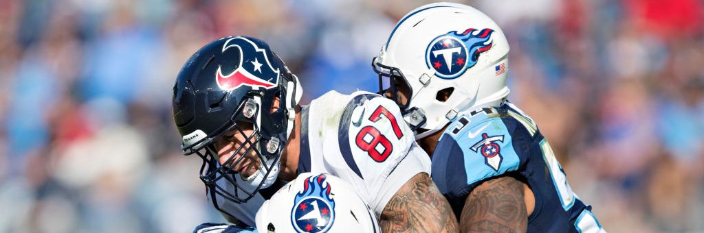 NASHVILLE, TN - DECEMBER 3: C.J. Fiedorowicz #87 of the Houston Texans is tackled by Kevin Byard #31 and Avery Williamson #54 of the Tennessee Titans at Nissan Stadium on December 3, 2017 in Nashville, Tennessee. The Titans defeated the Texans 23-14. (Photo by Wesley Hitt/Getty Images)