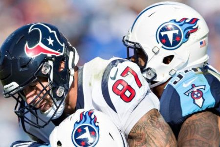 NASHVILLE, TN - DECEMBER 3:  C.J. Fiedorowicz #87 of the Houston Texans is tackled by Kevin Byard #31 and Avery Williamson #54 of the Tennessee Titans at Nissan Stadium on December 3, 2017 in Nashville, Tennessee.  The Titans defeated the Texans 23-14.  (Photo by Wesley Hitt/Getty Images)