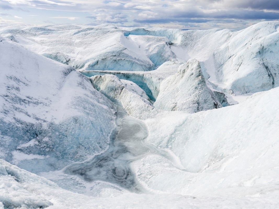 Landscape on the Greenland Ice Sheet near Kangerlussuaq. The people who monitor Greenland's ice live in extreme isolation. (Photo by: Martin Zwick/REDA&CO/UIG via Getty Images)