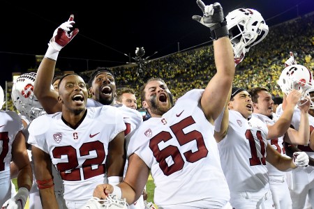 Stanford Cornerback Obi Eboh (22) and center Brian Chaffin (65) celebrate after defeating Oregon in overtime 38-31. (Photo by Steve Dykes/Getty Images)