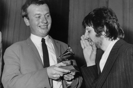 Drummer Ringo Starr of English congratulates EMI recording studio audio engineer Geoff Emerick (left) on his Grammy Award at the EMI studios in London, 7th March 1968. Emerick recently passed away at the age of 72. (Photo by Monti Spry/Central Press/Hulton Archive/Getty Images)