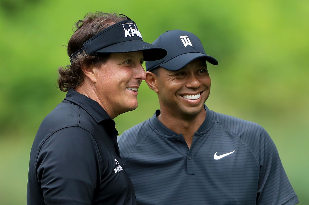 AKRON, OH - AUGUST 01:  Phil Mickelson (L) and Tiger Woods smile during a practice round prior to the World Golf Championships-Bridgestone Invitational at Firestone Country Club South Course on August 1, 2018 in Akron, Ohio. (Photo by Sam Greenwood/Getty Images)