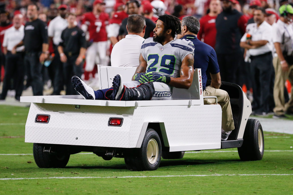Seattle Seahawks defensive back Earl Thomas (29) is carted off the field after being injured during the NFL football game between the Seattle Seahawks and the Arizona Cardinals on September 30, 2018 at State Farm Stadium in Glendale, Arizona. (Photo by Kevin Abele/Icon Sportswire via Getty Images)