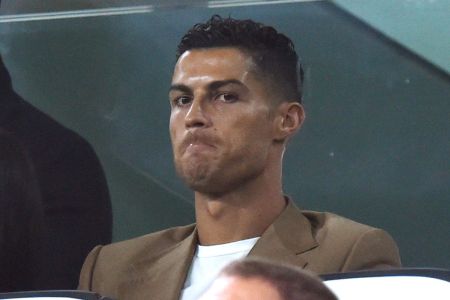 TURIN, ITALY - OCTOBER 02:  Cristiano Ronaldo of Juventus looks on in VIP standing during the Group H match of the UEFA Champions League between Juventus and BSC Young Boys at Allianz Stadium on October 2, 2018 in Turin, Italy.  (Photo by Tullio Puglia - UEFA/UEFA via Getty Images)