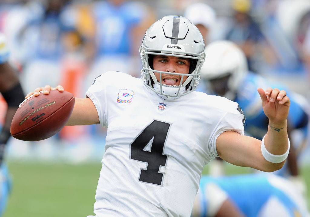CARSON, CA - OCTOBER 07: Oakland Raiders quarterback Derek Carr (4) slides after scrambling with the ball for a gain of yards in the third quarter of an NFL game against the Los Angeles Chargers played on October 7, 2018 at the StubHub Center in Carson, CA. (Photo by John Cordes/Icon Sportswire via Getty Images)