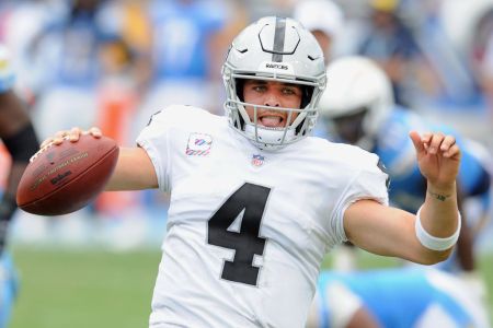 CARSON, CA - OCTOBER 07: Oakland Raiders quarterback Derek Carr (4) slides after scrambling with the ball for a gain of yards in the third quarter of an NFL game against the Los Angeles Chargers played on October 7, 2018 at the StubHub Center in Carson, CA. (Photo by John Cordes/Icon Sportswire via Getty Images)