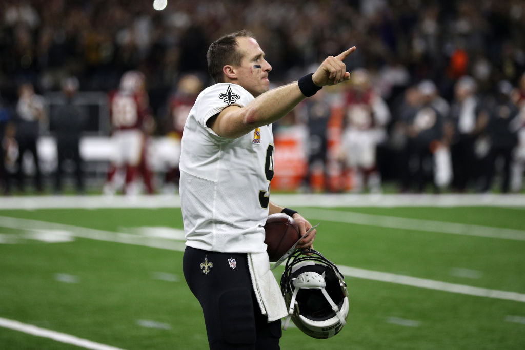 Drew Brees #9 of the New Orleans Saints reacts after throwing a 62 yard pass to take the all time yardage record against the Washington Redskins at Mercedes-Benz Superdome on October 8, 2018 in New Orleans, Louisiana.  (Photo by Chris Graythen/Getty Images)