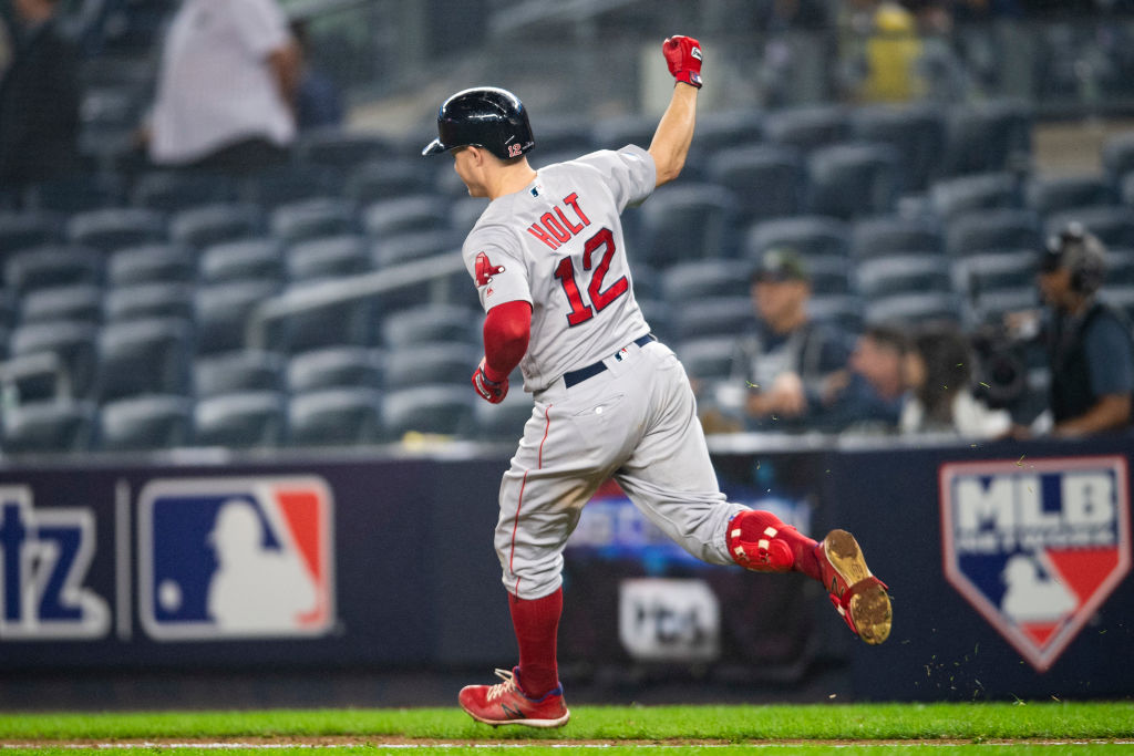 Brock Holt #12 of the Boston Red Sox reacts after hitting a home run during the inning of game three of the American League Division Series to hit for the cycle against the New York Yankees on October 8, 2018 at Yankee Stadium in the Bronx borough of New York City. (Photo by Billie Weiss/Boston Red Sox/Getty Images)
