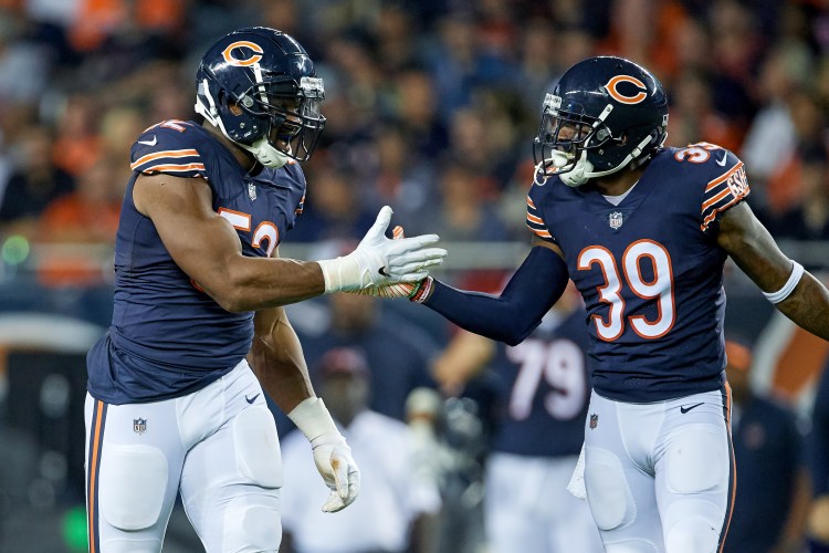 CHICAGO, IL - SEPTEMBER 17: Chicago Bears linebacker Khalil Mack (52) celebrates with Chicago Bears defensive back Eddie Jackson (39) after a play in game action during an NFL game between the Chicago Bears and the Seattle Seahawks on September 17, 2018 at Soldier Field in Chicago, Illinois. (Photo by Robin Alam/Icon Sportswire via Getty Images)