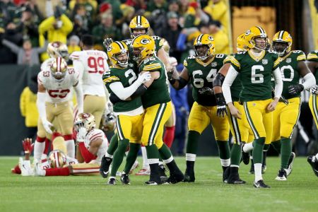 Mason Crosby #2 of the Green Bay Packers celebrates with teammates after kicking a field goal to beat the San Francisco 49ers 33-30 at Lambeau Field on October 15, 2018 in Green Bay, Wisconsin. (Photo by Dylan Buell/Getty Images)