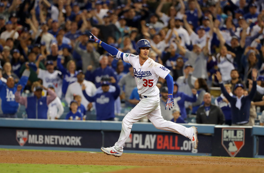 LOS ANGELES, CA - OCTOBER 16:  Cody Bellinger #35 of the Los Angeles Dodgers reacts after hitting a walk-off RBI single in the 13th inning of Game 4 of the NLCS against the Milwaukee Brewers at Dodger Stadium on Tuesday, October 16, 2018 in Los Angeles, California. (Photo by Alex Trautwig/MLB Photos via Getty Images)