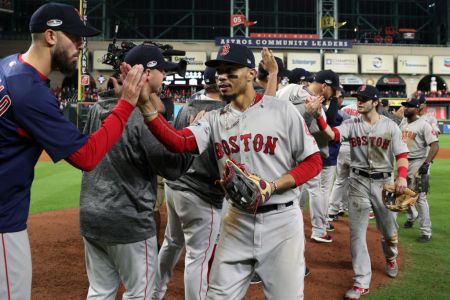 HOUSTON, TX - OCTOBER 17:  Mookie Betts #50 of the Boston Red Sox celebrates with teammates after Red Sox defeated the Houston Astros in Game 4 of the ALCS at Minute Maid Park on Wednesday, October 17, 2018 in Houston, Texas. (Photo by Loren Elliott/MLB Photos via Getty Images)