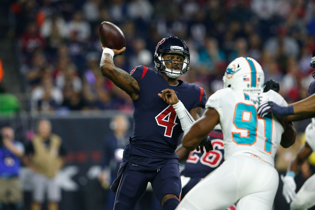 HOUSTON, TX - OCTOBER 25:  Deshaun Watson #4 of the Houston Texans throws a pass pressured by Cameron Wake #91 of the Miami Dolphins in the first quarter at NRG Stadium on October 25, 2018 in Houston, Texas.  (Photo by Tim Warner/Getty Images)