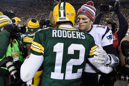 Tom Brady #12 of the New England Patriots (R) congratulates fellow quarterback Aaron Rodgers #12 of the Green Bay Packers after their game at Lambeau Field on November 30, 2014 in Green Bay, Wisconsin.  (Photo by Brian D. Kersey/Getty Images)