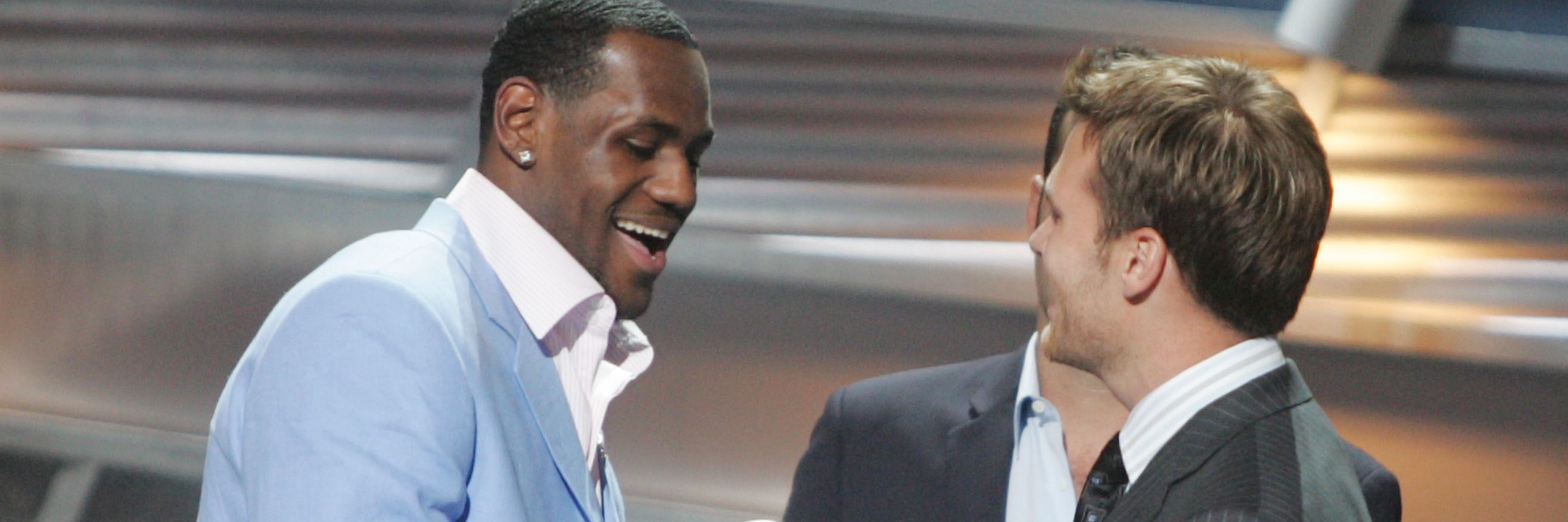 HOLLYWOOD - JULY 14: Winner for Best Breakthrough athlete, basketball player LeBron James is greeted on stage by quarterback Tom Brady at the 12th Annual ESPY Awards held at the Kodak Theatre on July 14, 2004 in Hollywood, California. This year's ESPY's will air Sunday, July 16th on ESPN beginning 9 PM EST/6 PM EST. (Photo by Carlo Allegri/Getty Images)