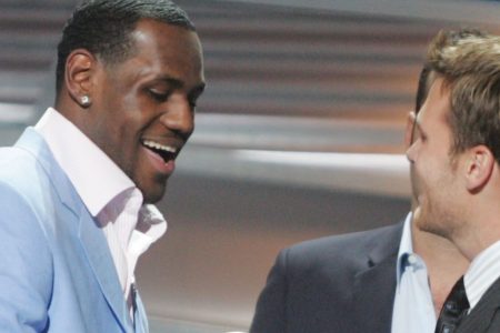 HOLLYWOOD - JULY 14:  Winner for Best Breakthrough athlete, basketball player LeBron James is greeted on stage by quarterback Tom Brady at the 12th Annual ESPY Awards held at the Kodak Theatre on July 14, 2004 in Hollywood, California.  This year's ESPY's will air Sunday, July 16th on ESPN beginning 9 PM EST/6 PM EST.  (Photo by Carlo Allegri/Getty Images)
