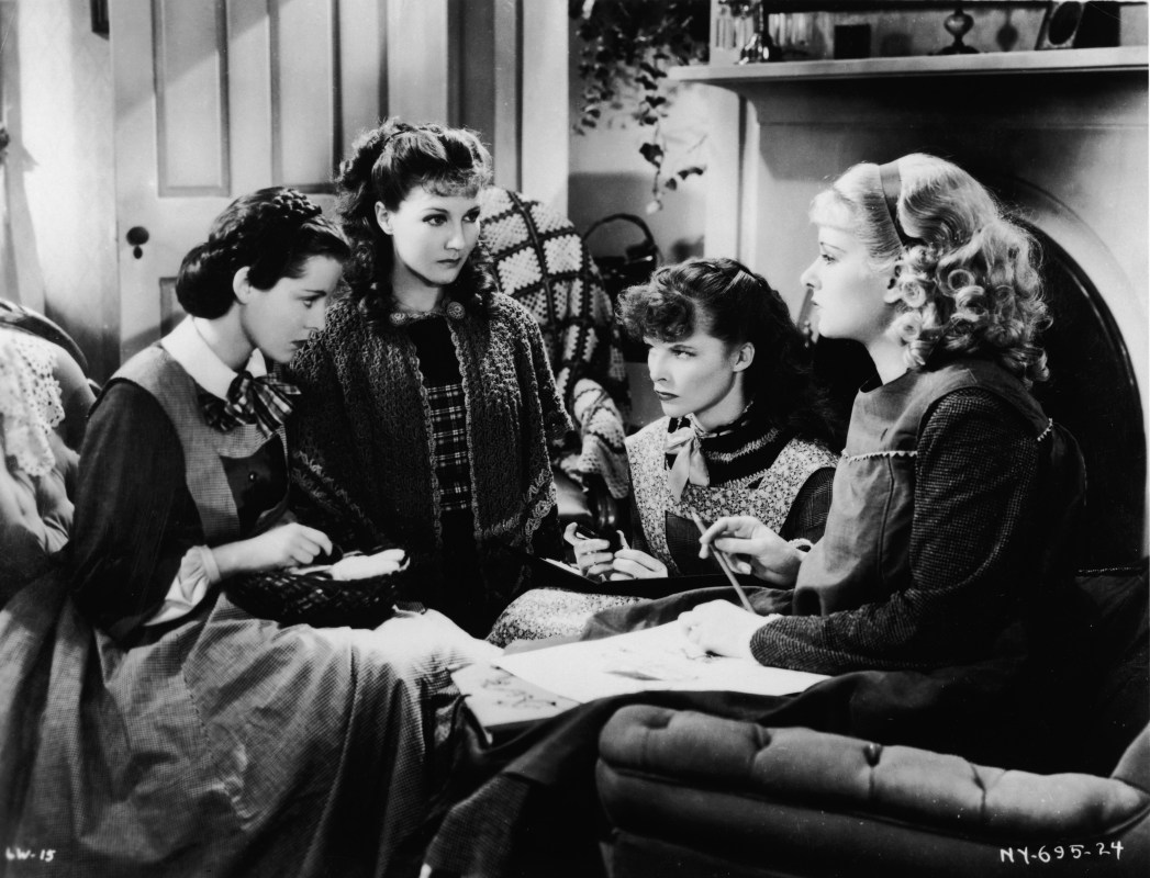 American actresses (left to right) Frances Dee (1909 - 2004), Jean Parker, Katharine Hepburn (1907 - 2003), and Joan Bennett (1910 - 1990) sit and glare at one another as the March girls in this still from a film adaptation of Louisa May Alcott's 'Little Women' directed by George Cukor, 1933. (Photo by RKO Pictures/Courtesy of Getty Images)