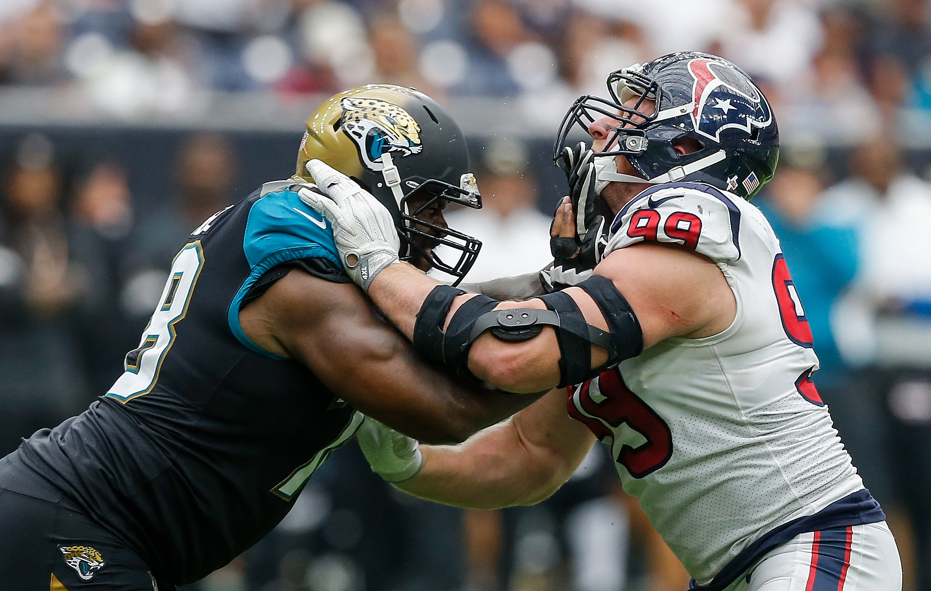 HOUSTON, TX - SEPTEMBER 10: Jermey Parnell #78 of the Jacksonville Jaguars and J.J. Watt #99 of the Houston Texans lock up at NRG Stadium on September 10, 2017 in Houston, Texas. (Photo by Bob Levey/Getty Images)