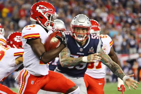 FOXBORO, MA - SEPTEMBER 07:  De'Anthony Thomas #13 of the Kansas City Chiefs runs the ball before being tackled by Cassius Marsh #55 of the New England Patriots during a game against the New England Patriots during the second half at Gillette Stadium on September 7, 2017 in Foxboro, Massachusetts.  (Photo by Adam Glanzman/Getty Images)