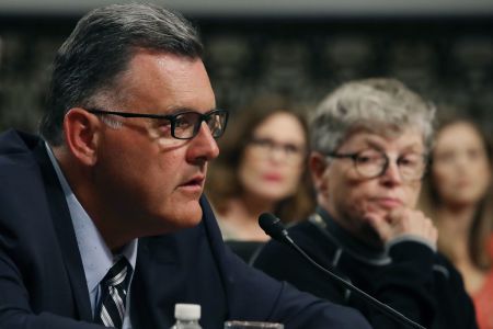 WASHINGTON, DC - JUNE 05: Steve Penny, former president of USA Gymnastics, pleads the Fifth, while seated next to Lou Anna Simon,(R), former president of Michigan State University, during a Senate Commerce, Science and Transportation Committee hearing, on June 5, 2018 in Washington, DC. The hearing focused on preventing abuse in Olympic and amateur athletics and ensuring a safe and secure environment for athletes.  (Photo by Mark Wilson/Getty Images)