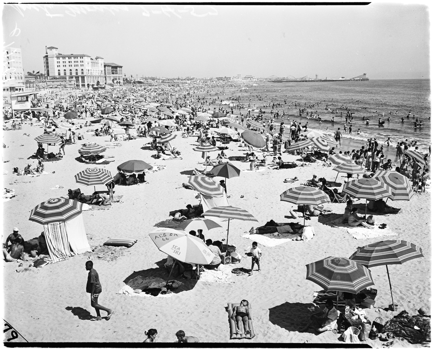 General views of crowd at Santa Monica beach, Santa Monica, California, April 13, 1958. Nick Gabaldón Day now celebrates the contributions of black surfers in California to combatting racism on the beaches. (Photo by USC Libraries/Corbis via Getty Images)