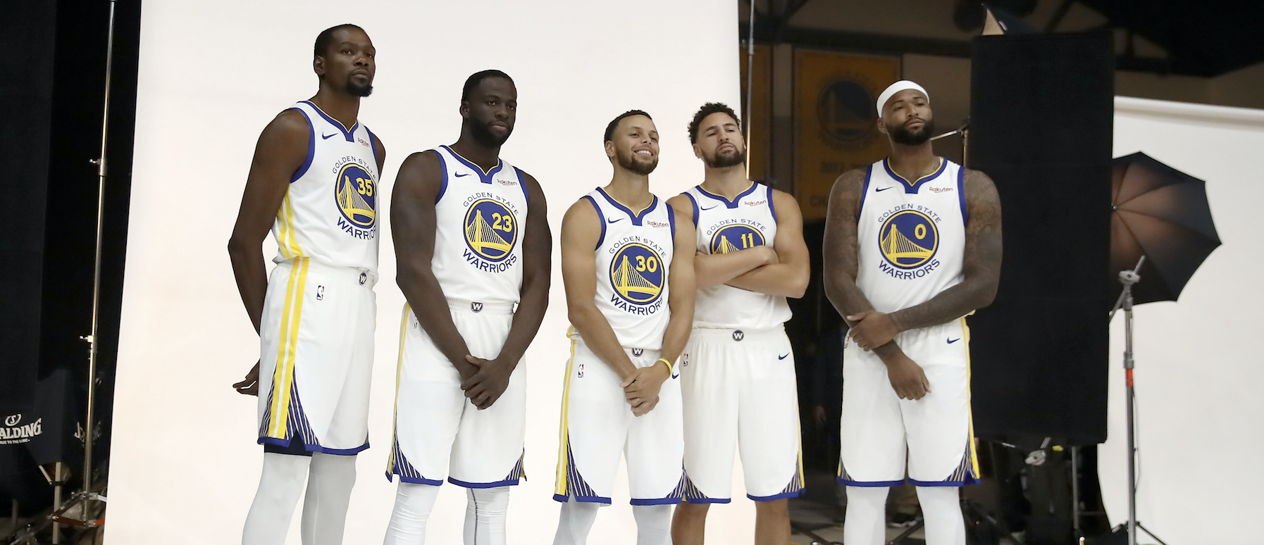OAKLAND, CA - SEPTEMBER 24: (L-R) Kevin Durant #35, Draymond Green #23, Stephen Curry #30, Klay Thompson #11, and DeMarcus Cousins #0 of the Golden State Warriors pose for a group picture during the Golden State Warriors media day on September 24, 2018 in Oakland, California. (Photo by Ezra Shaw/Getty Images)