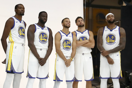 OAKLAND, CA - SEPTEMBER 24: (L-R) Kevin Durant #35, Draymond Green #23, Stephen Curry #30, Klay Thompson #11, and DeMarcus Cousins #0 of the Golden State Warriors pose for a group picture during the Golden State Warriors media day on September 24, 2018 in Oakland, California. (Photo by Ezra Shaw/Getty Images)