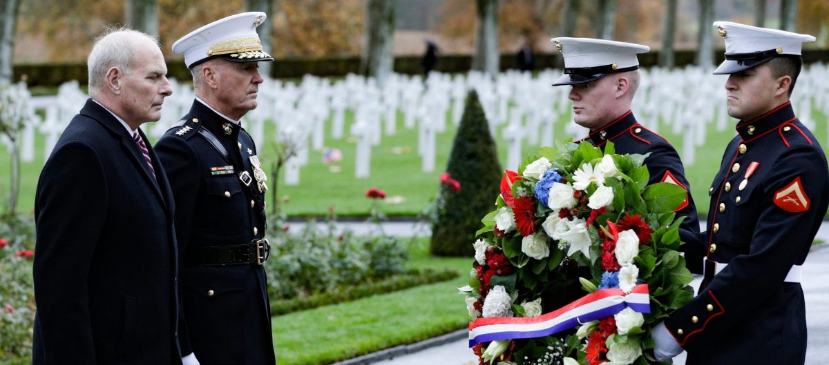 General Joseph Dunford (second from left)) and retired Marine Corps general and current White House Chief of Staff John F. Kelly visit the Aisne-Marne American Cemetery and Memorial in Belleau, France, on November 10, 2018 as part of commemorations marking the 100th anniversary of the 11 November 1918 armistice, ending World War I. Due to logistical difficulties caused by rain, President Trump did not attend. (Photo credit: GEOFFROY VAN DER HASSELT/AFP/Getty Images)