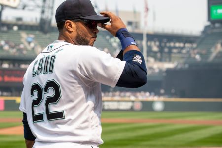 SEATTLE, WA - AUGUST 22: Robinson Cano #22 of the Seattle Mariners adjust his cap before a game at Safeco Field on August 22, 2018 in Seattle, Washington. The Astros won the game 10-7. (Photo by Stephen Brashear/Getty Images)