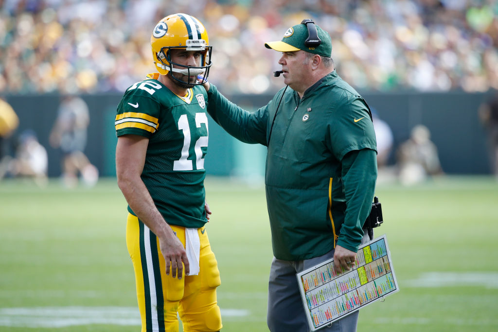 Head coach Mike McCarthy of the Green Bay Packers talks with Aaron Rodgers #12 during the game against the Minnesota Vikings at Lambeau Field on September 16, 2018 in Green Bay, Wisconsin. The game ended in a 29-29 tie. (Photo by Joe Robbins/Getty Images)