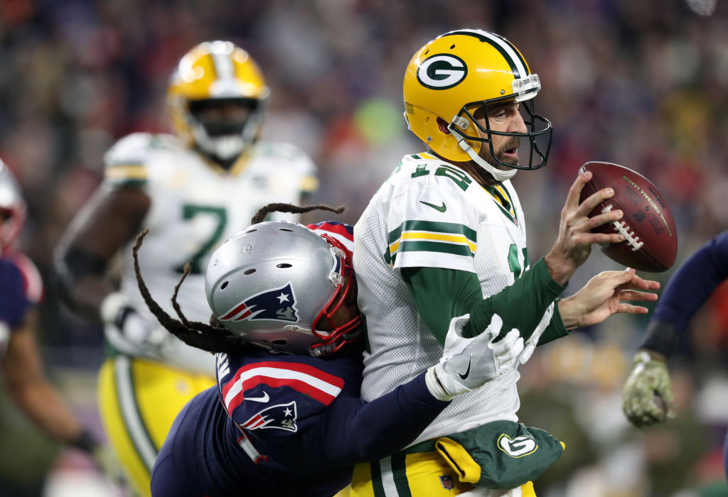 New England Patriots' Adrian Clayborn pressures Packers quarterback Aaron Rodgers during the fourth quarter. (Photo by Jim Davis/The Boston Globe via Getty Images)