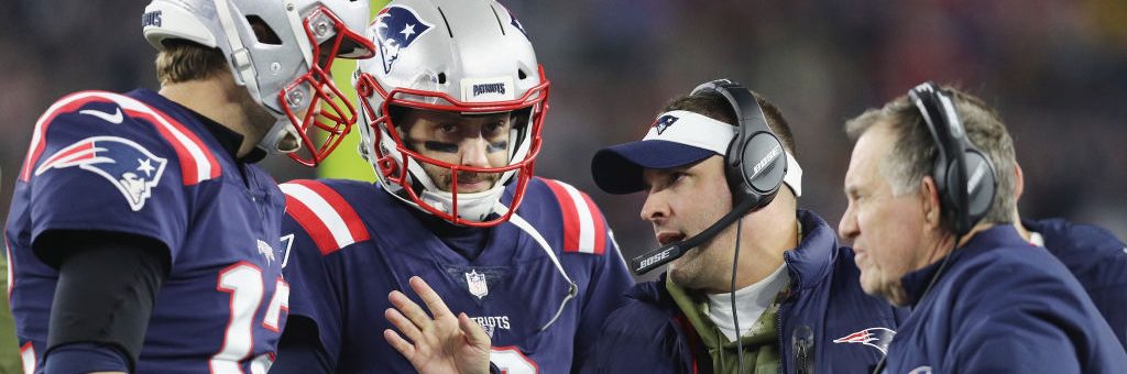 FOXBOROUGH, MA - NOVEMBER 04:  Tom Brady #12 talks with Brian Hoyer #2, offensive coordinator Josh McDaniels and head coach Bill Belichick of the New England Patriots during the first half against the Green Bay Packers at Gillette Stadium on November 4, 2018 in Foxborough, Massachusetts.  (Photo by Maddie Meyer/Getty Images)