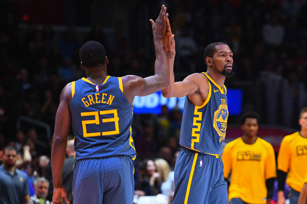 LOS ANGELES, CA - NOVEMBER 12: Golden State Warriors Forward Draymond Green (23) gives Golden State Warriors Forward Kevin Durant (35) a high five during a NBA game between the Golden State Warriors and the Los Angeles Clippers on November 12, 2018 at STAPLES Center in Los Angeles, CA. (Photo by Brian Rothmuller/Icon Sportswire via Getty Images)
