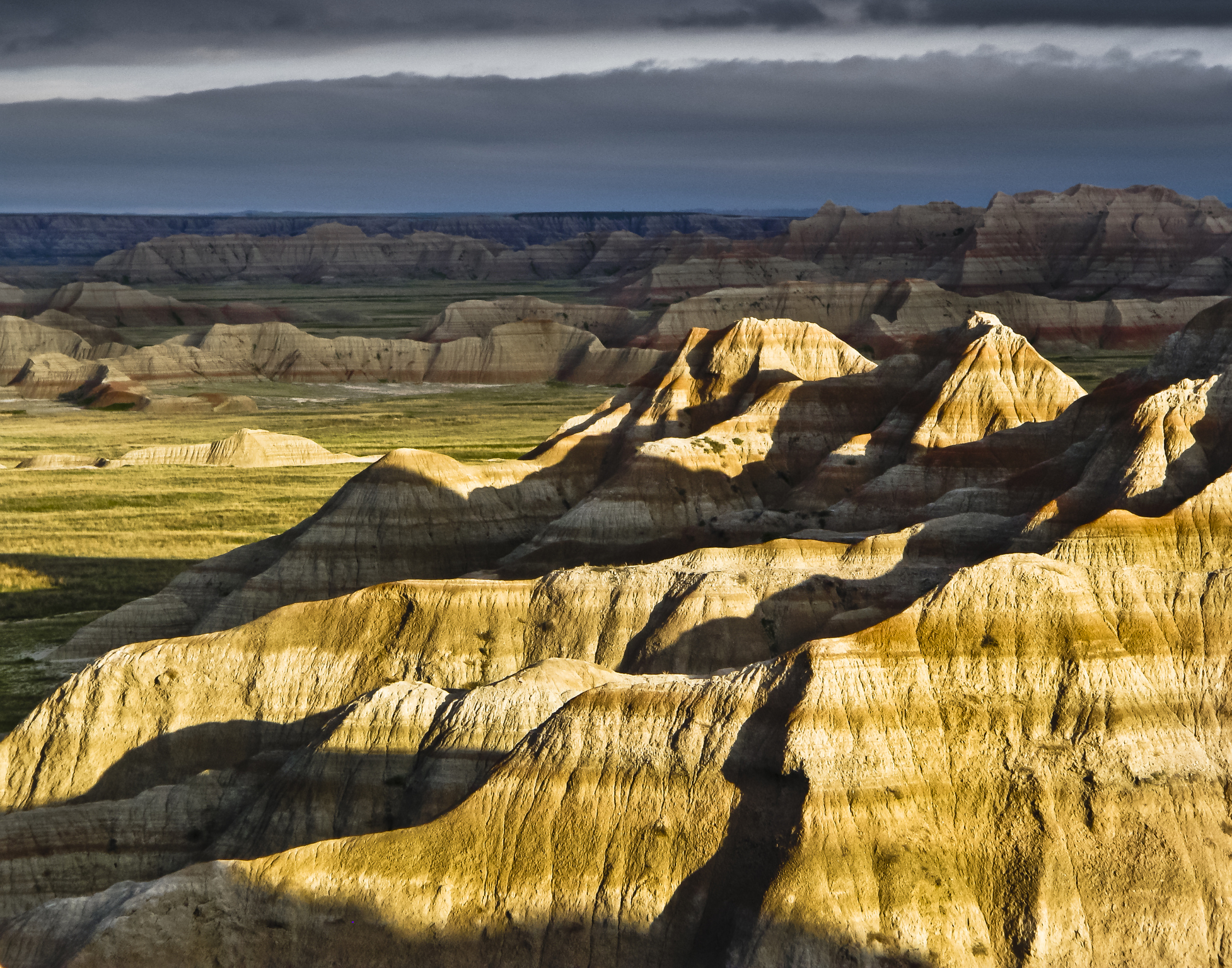 Distant clouds made for interesting background against a lightened foreground.  Morning sunrise shadows added a little extra to the mood.  Badlands National Park. Finalist in The Nature Conservancy's 2010, 5th Annual Digital Photo Contest (Getty)