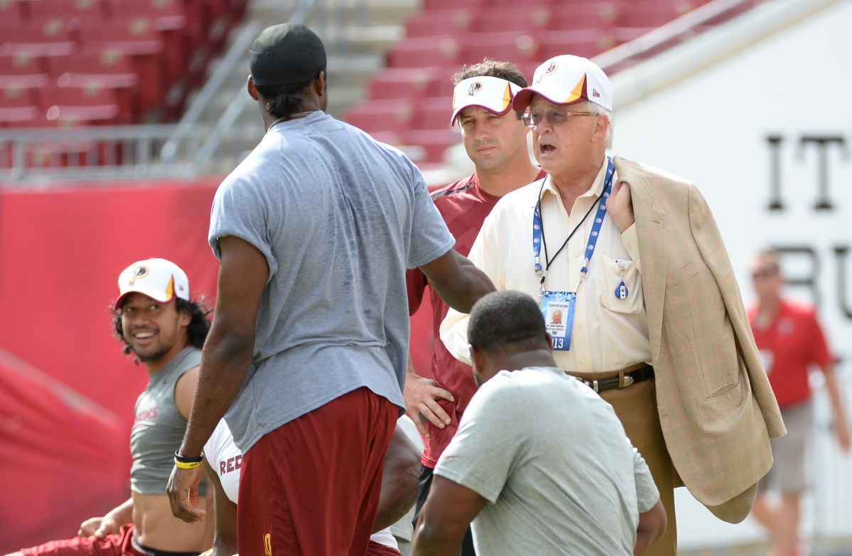 TAMPA, FL  August  29:  Dr. James Andrews talks with Washington Redskins quarterback Robert Griffin III (10) prior to action against the Tampa Bay Buccaneers on August 29,  2013 in Tampa, FL   (Photo by Jonathan Newton / The Washington Post via Getty Images)