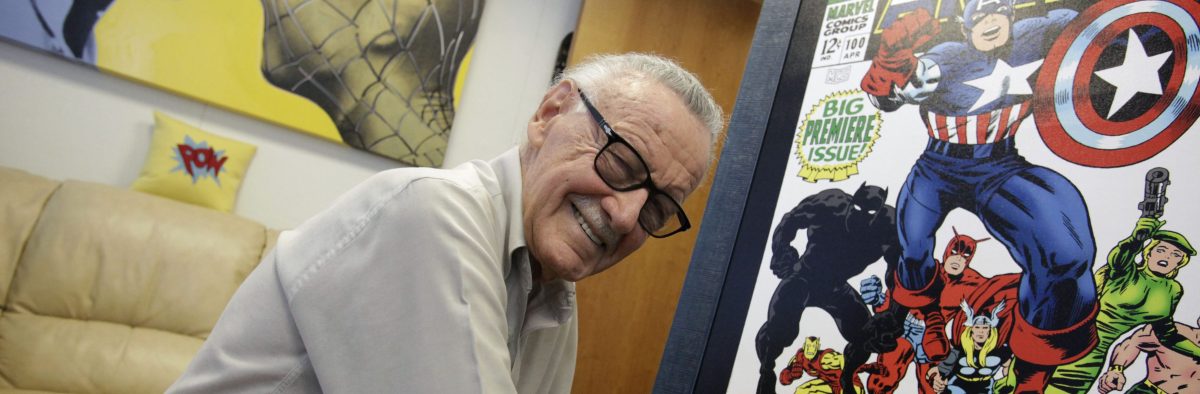 Stan Lee pictured signing poster for an exhibit in his Beverly Hills office in 2009.  (Photo by Barbara Davidson/Los Angeles Times via Getty Images)