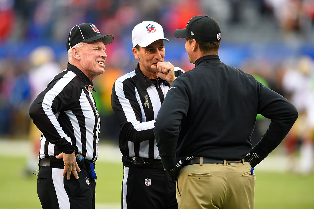November 16, 2014: Field Judge Bob Waggoner (25), Referee Gene Steratore (114) talk with San Francisco 49ers head coach Jim Harbaugh prior to a NFL game between the San Francisco 49ers and the New York Giants at MetLife Stadium in East Rutherford, NJ  (Photo by Rich Kane/Icon Sportswire/Corbis via Getty Images)
