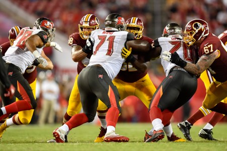 TAMPA, FL - AUGUST 31: Washington Redskins wide receiver Levern Jacobs (88) and Washington Redskins offensive lineman Ronald Patrick (62) block Tampa Bay Buccaneers defensive end Channing Ward (71) during an NFL preseason football game between the Washington Redskins and the Tampa Bay Buccaneers on August 31, 2017, at Raymond James Stadium in Tampa, FL. (Photo by Roy K. Miller/Icon Sportswire via Getty Images)
