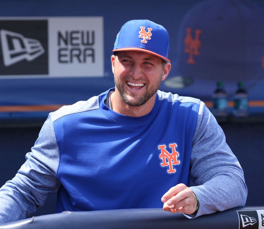 PORT ST. LUCIE, FL - MARCH 7: Tim Tebow #83 of the New York Mets looks on from the dugout at the start of the spring training game against the New York Yankees at First Date Field on March 7, 2018 in Port St. Lucie, Florida. (Photo by Joel Auerbach/Getty Images)